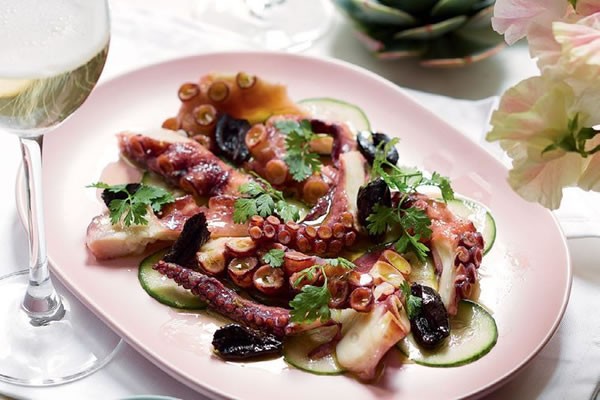 Pickled octopus with cucumber and black olives